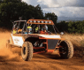 ATV driving down a dirt road in Kauai