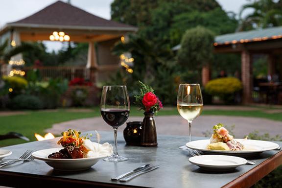 a plate of food and a glass of wine